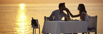 Couple dining on adult-only beach