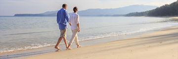 Couple walking along the beach