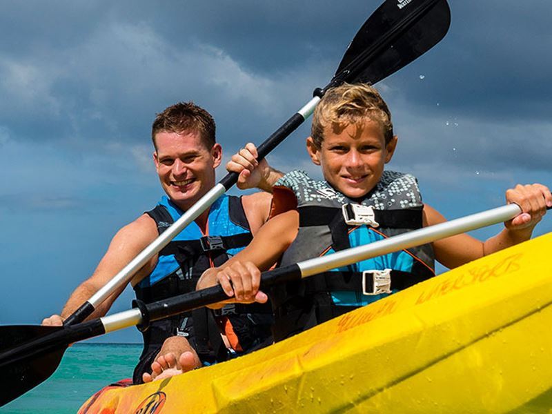 dad and son kayaking waves hotel and spa