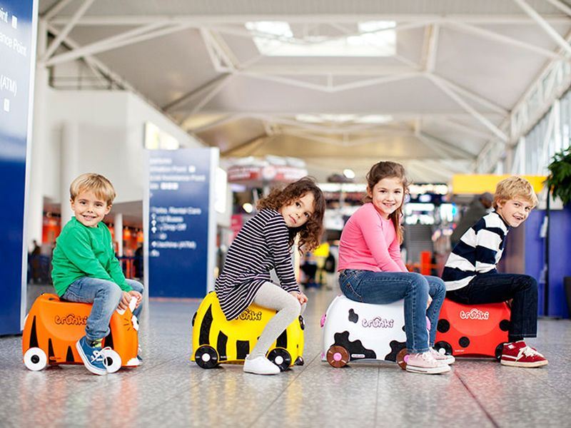 Kids riding their Trunki's at the airport